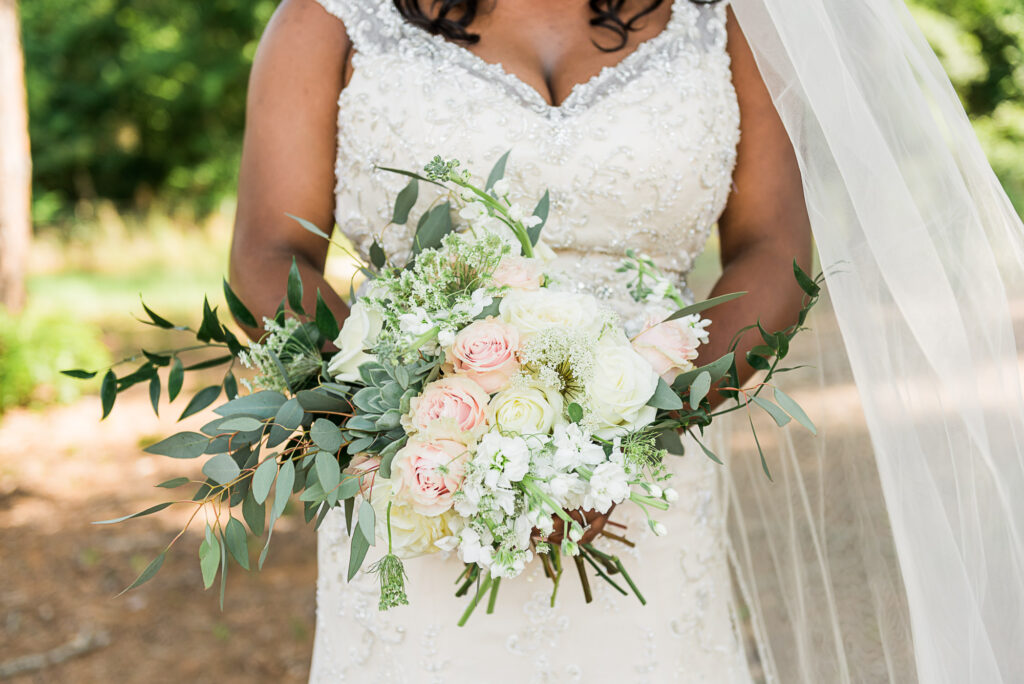 Bride holding Flowers at Belle Vue Wedding Venue in Tyler, Texas by Wedding Photographer Candace Pair